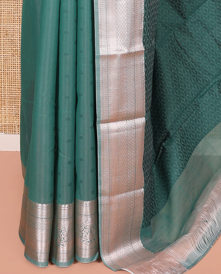 Blue Semi-Silk Cotton Saree, Sparsely Woven with Floral Buttas on Its Body, Highlighted by a Zari Traditional Border, Geometric Patterned Pallu, and Paired with a Matching Blouse