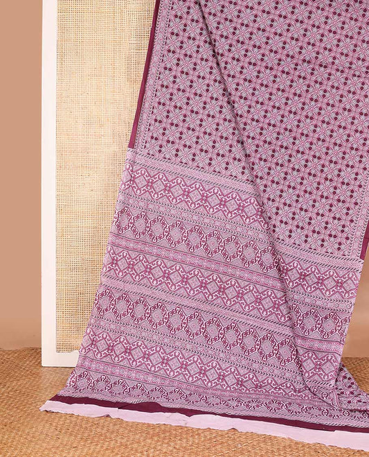 Purple intricately printed mul mul cotton saree, geometric printed border, and pallu