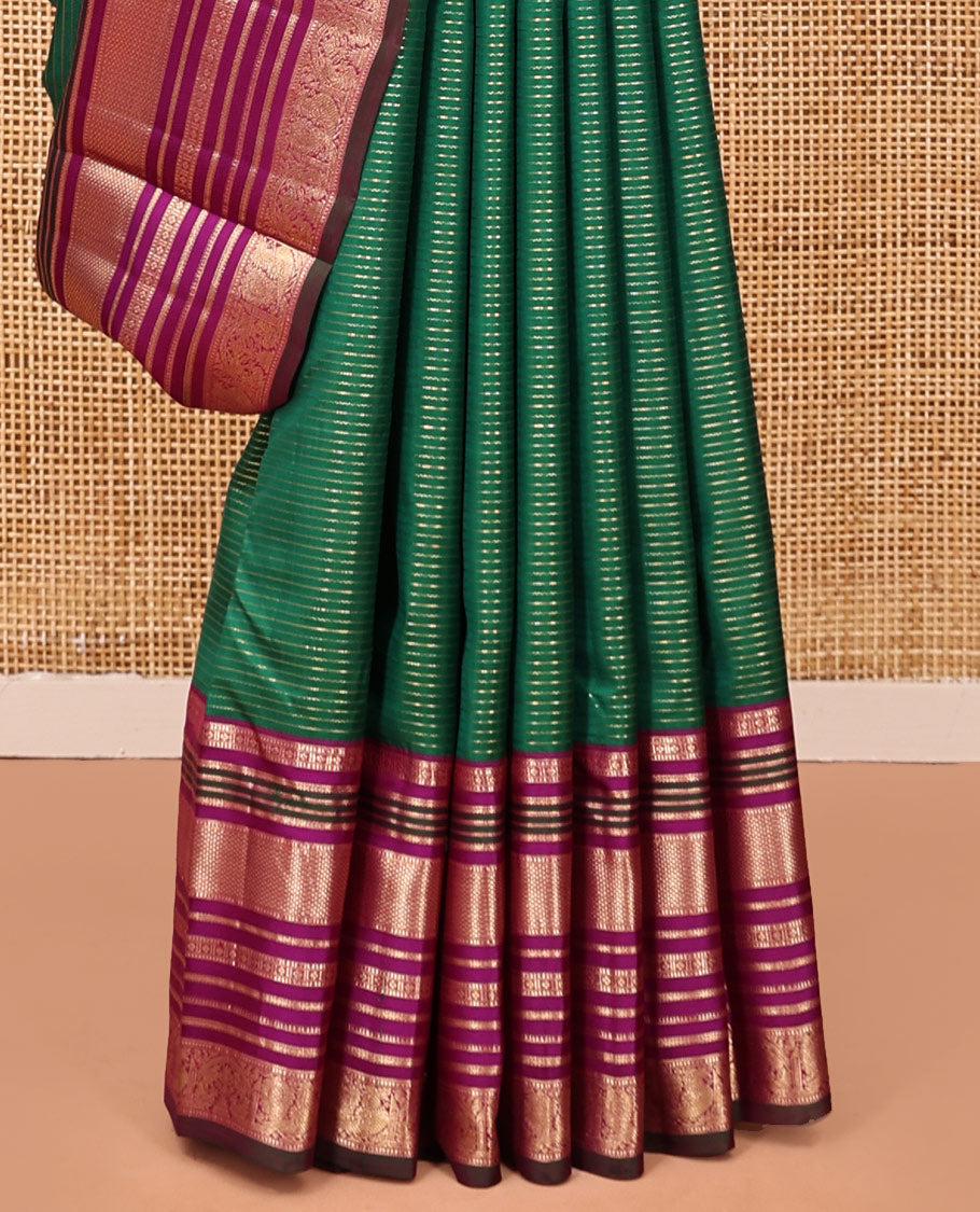 Green-Magenta Vasundhara Silk Saree Features Veldhari and Muthu Stripes, Contrast Border of Muthu,Lavangam,Neli,Mayil Kann, and Mayil, Grand Pallu, and Contrast Blouse