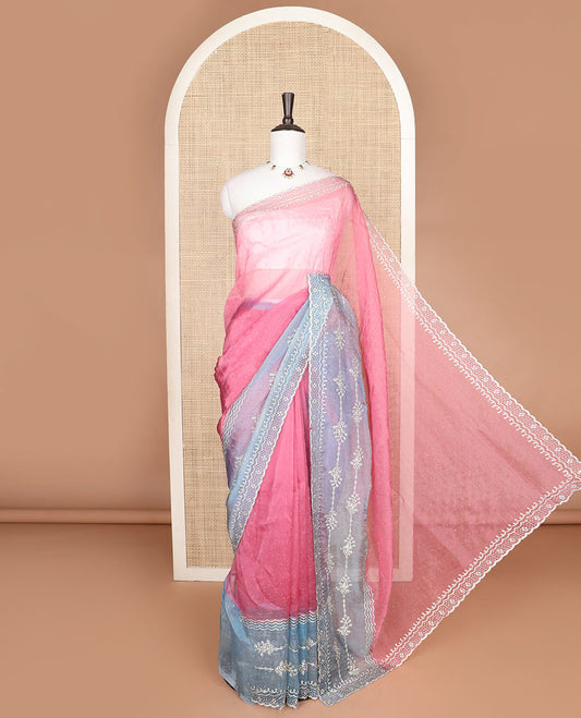 Pink embroidered designer saree with stones embedded in its body, contrast scallop stone work border