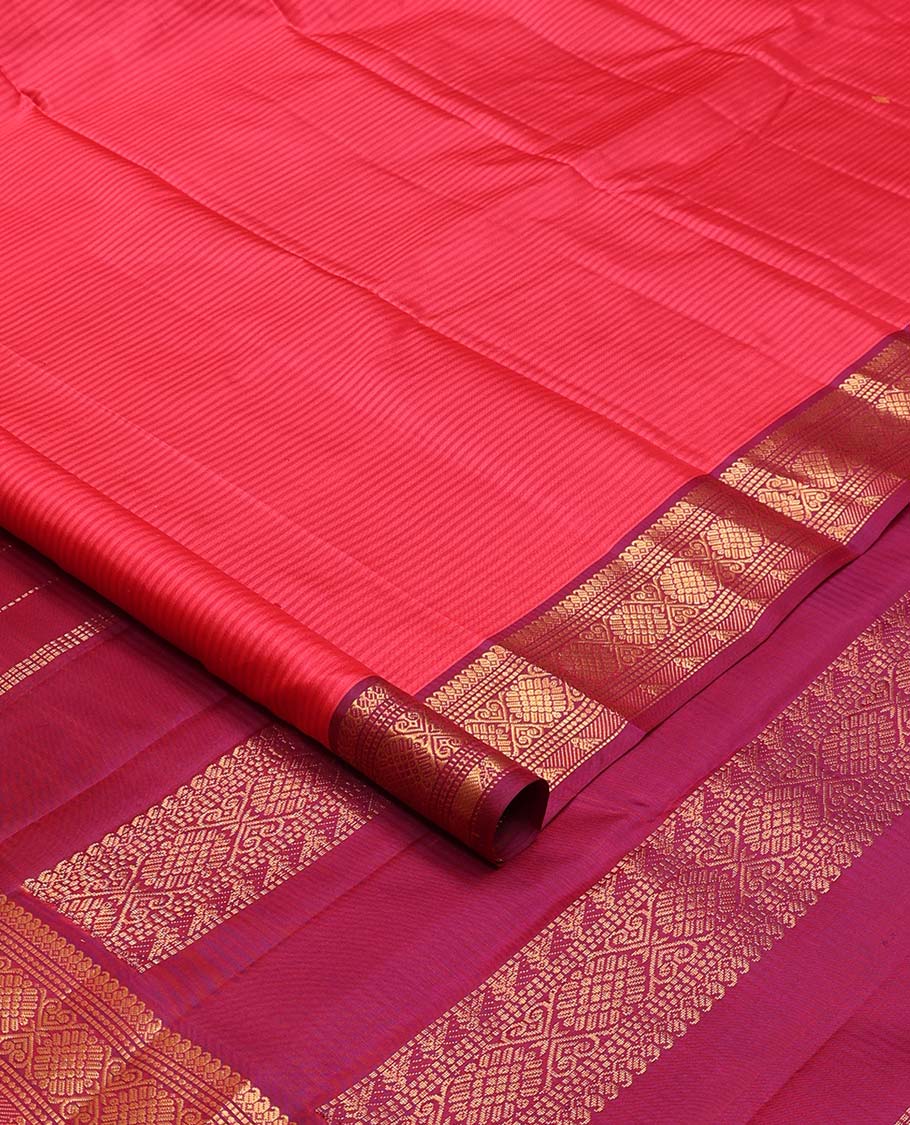 Pink striped and buttas Kanchipuram silk saree, contrast border of thilakam mokku, muthu, jadai nagam, and kili motifs and traditional zari design pallu