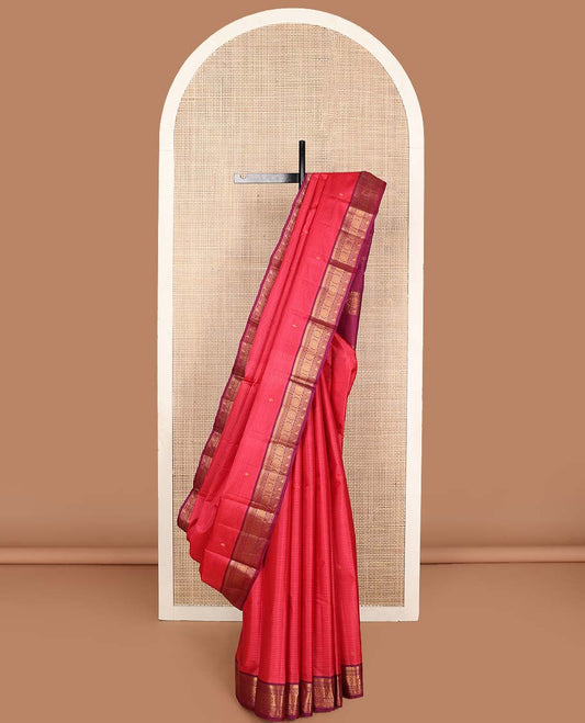 Pink striped and buttas Kanchipuram silk saree, contrast border of thilakam mokku, muthu, jadai nagam, and kili motifs and traditional zari design pallu