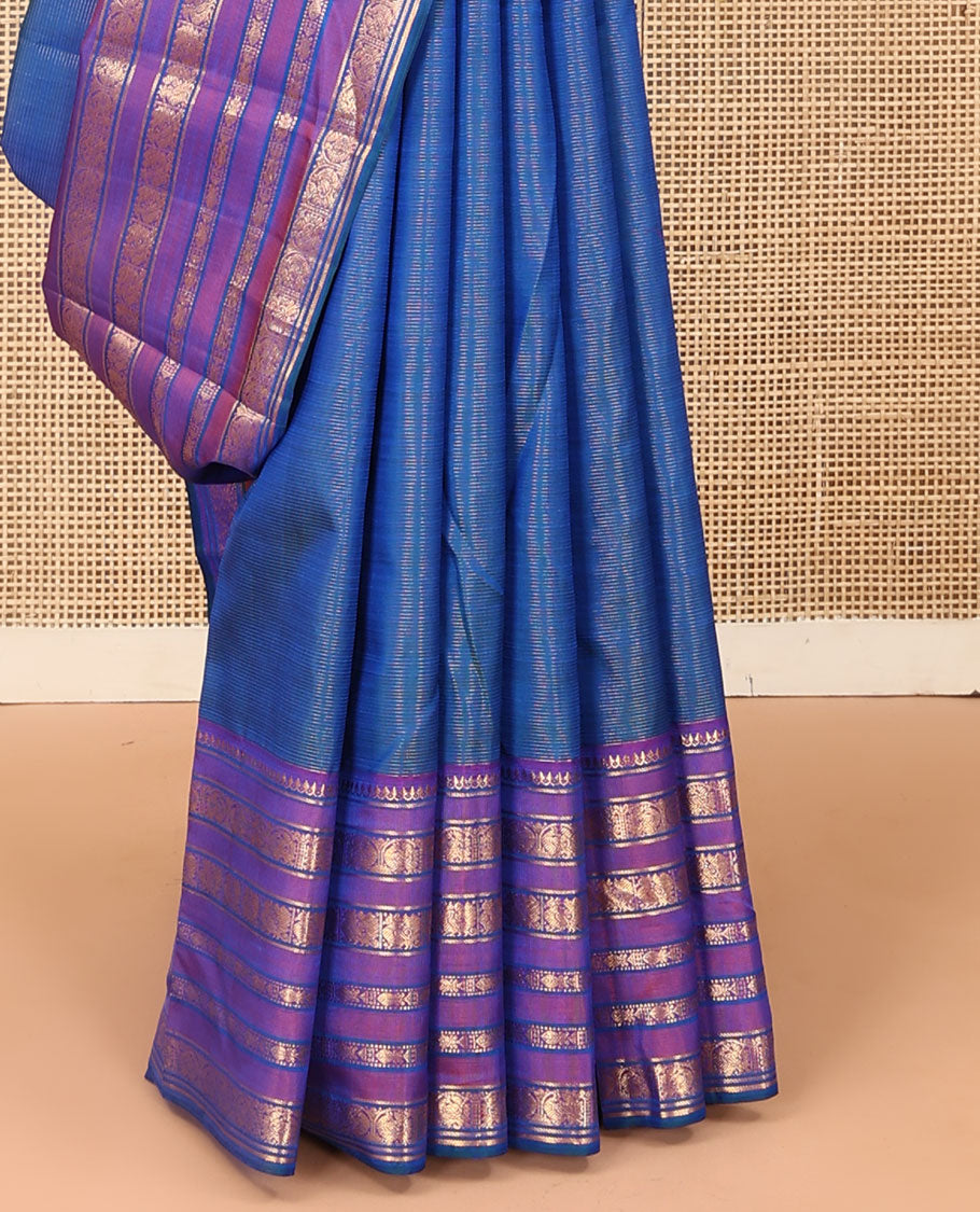 Blue striped and mayil buttas Kanchipuram silk saree, contrast border of thilakam mokku, mayil, and meen designs and annam chakram butta enclosed checked pallu