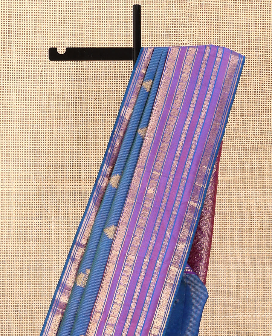 Blue striped and mayil buttas Kanchipuram silk saree, contrast border of thilakam mokku, mayil, and meen designs and annam chakram butta enclosed checked pallu
