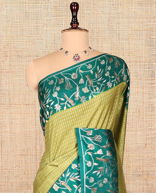 Green Matka Silk Saree, Finely Crafted with Buttas on Its Body, Complemented by Contrast Floral Vine and Bird Design Border, Pallu of Floral Vine and Bird Design, and Paired with a Contrast Blouse