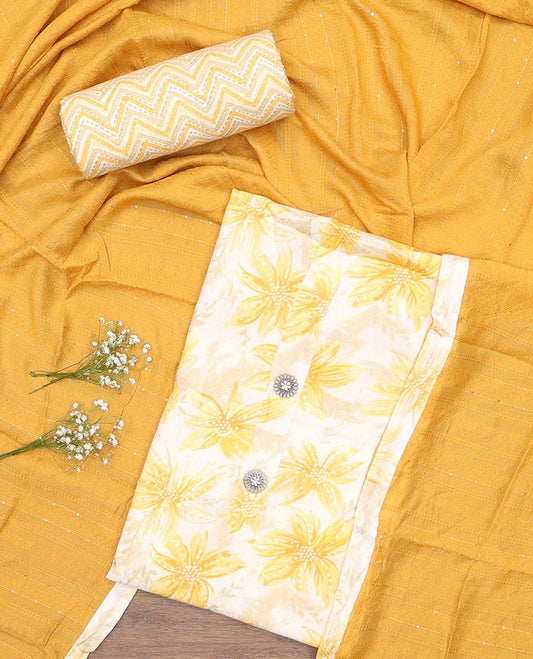 Yellow material churidar set, sunflower motifs printed with button stitched cotton top, contrast chevron printed cotton bottom, and textured chanderi dupatta of sequins stripes