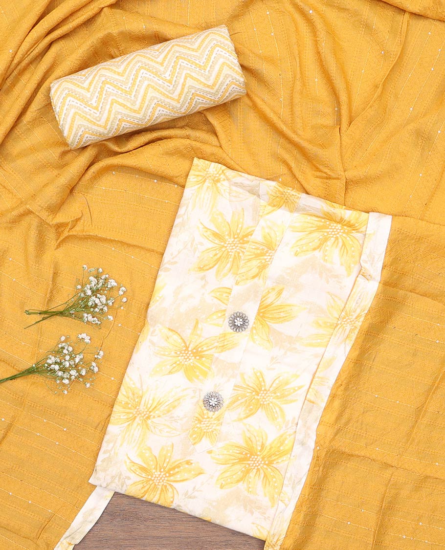 Yellow material churidar set, sunflower motifs printed with button stitched cotton top, contrast chevron printed cotton bottom, and textured chanderi dupatta of sequins stripes