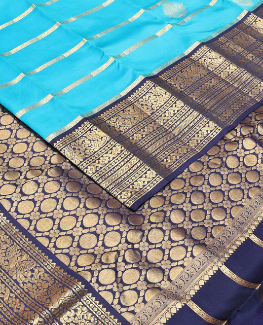 Blue thick zari striped Vasundhara silk mix saree, contrast border of rekku,mayil,neli,kathir & cross kamalam & intricate pallu