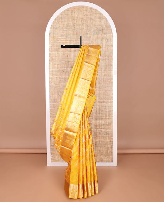Yellow geometric design kancheepuram silk saree with self border of rekku, banaras, paun design & floral pallu
