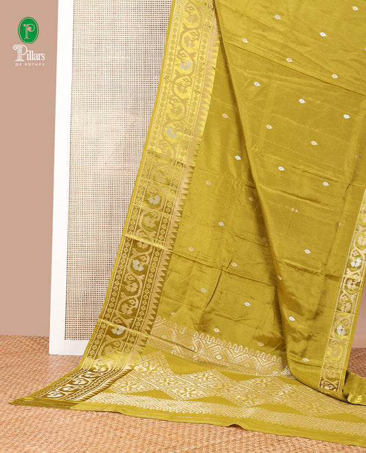 Mustard zari butta dola silk saree with patola style design, temple border & rich pallu along with plain blouse