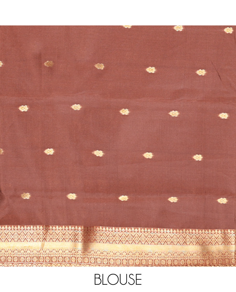 Rust Orange Kanchi Silk Saree, Beautified with Floral Zari Buttas All Over Its Body, Complemented by a Contrast Border of Traditional Zari Designs, Majestically Detailed Pallu, and Paired with a Contrast Blouse