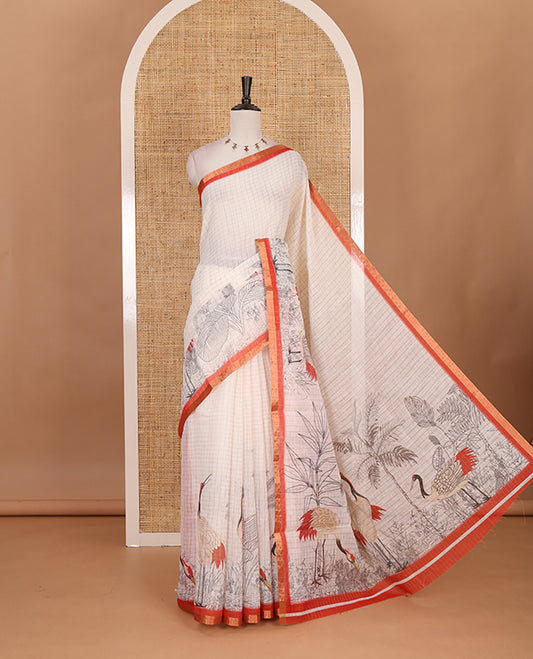 White with orange zari checks linen saree with contrast border and unique designs of pallu along with contrast plain blouse