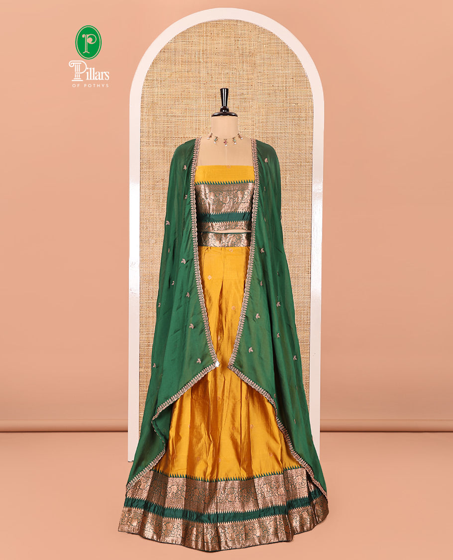 Yellow-Green Semi-Banarasi Half-Saree Subtly Sparkled with Zari Buttas on Its Skirt, Complemented by a Contrast Traditional Zari Temple Rettai Pettu Border, Paired with a Matching Blouse, and a Satin Georgette Embroidered Scallop Dhavani