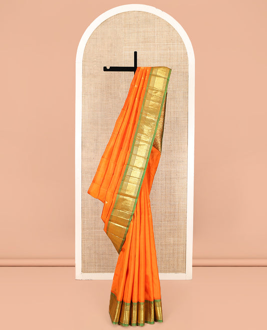 Orange Kanchipuram Silk Saree, Crafted with Zari Buttas, Complemented by a Contrast One-Sided Border of Panner Sombu, Banaras, Muthu and Mayil Kann Designs, Grand Jaal Pallu, and No Blouse