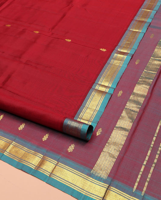 Red Kanchipuram Silk Saree, Mesmerized with Zari Buttas on Its Body, Complemented by a Contrast One-Sided Border of Banaras, and Mayil Kann Designs, Pallu of Zari Designs, and Comes Without a Blouse
