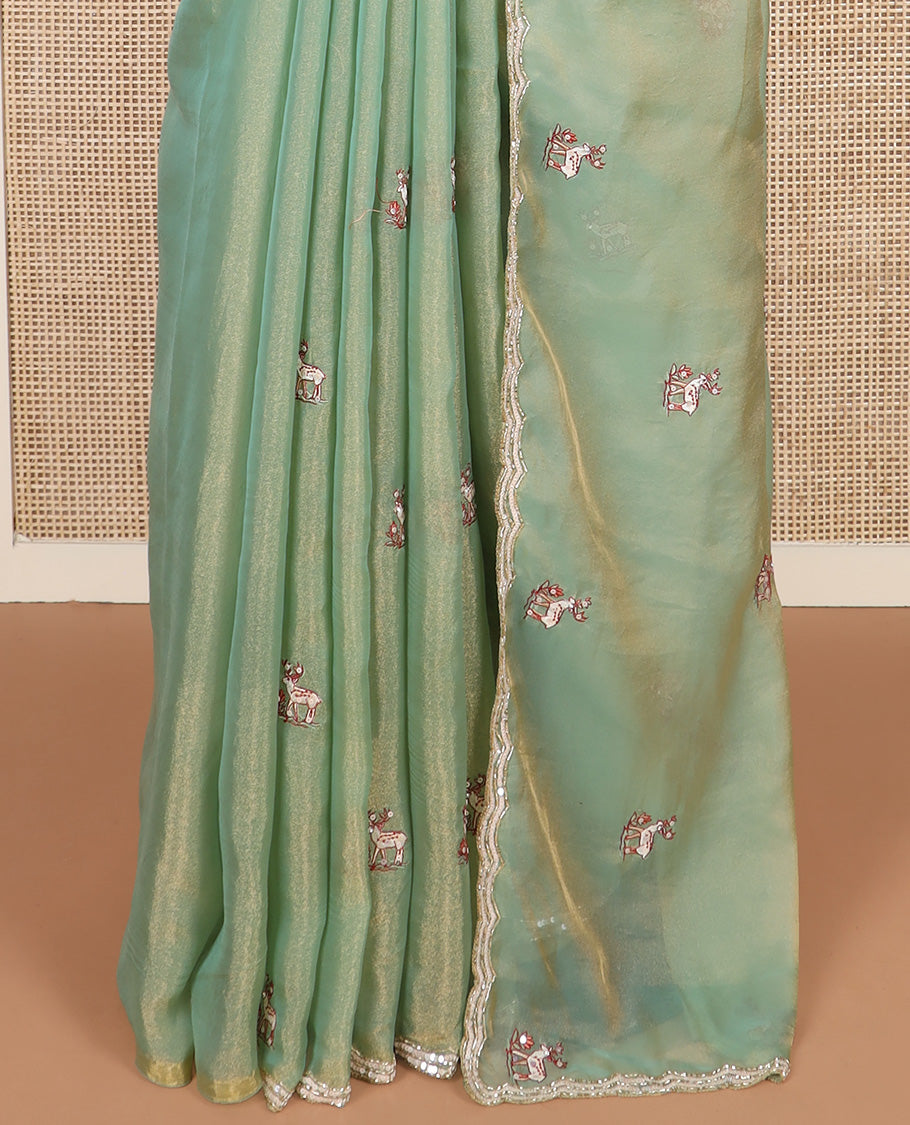 Pista green deer motifs embroidered designer saree, scallop sequins embroidered border