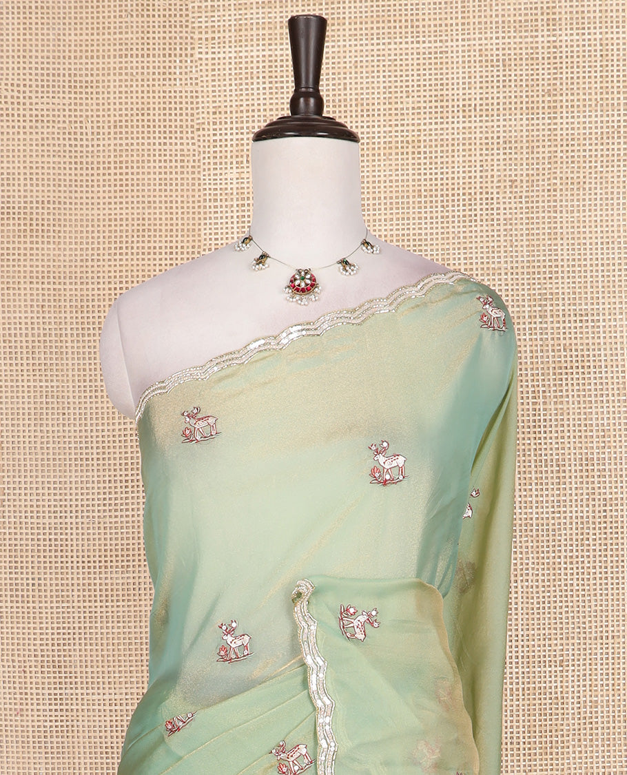 Pista green deer motifs embroidered designer saree, scallop sequins embroidered border