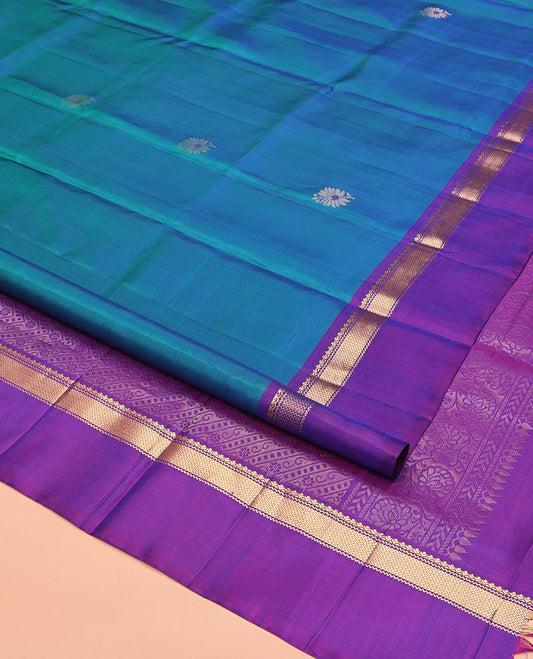Blue Mayuri Soft Silk Saree Spotlighted with Zari Buttas All Over Its Body, Complemented by Kal Erangina Border of Vanki Designs, Diagonally Woven Pallu and Paired with a Contrast Blouse