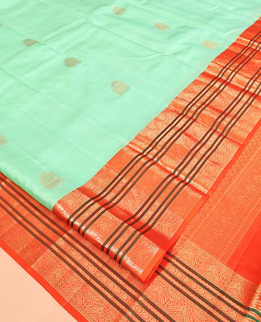 Turquoise Vasundhara Silk Saree, Finely Crafted with Zari Buttas, Complemented by a Contrast Border of Mayil, Neli, and Rudraksham Designs, Grand Pallu, and a Contrast Blouse