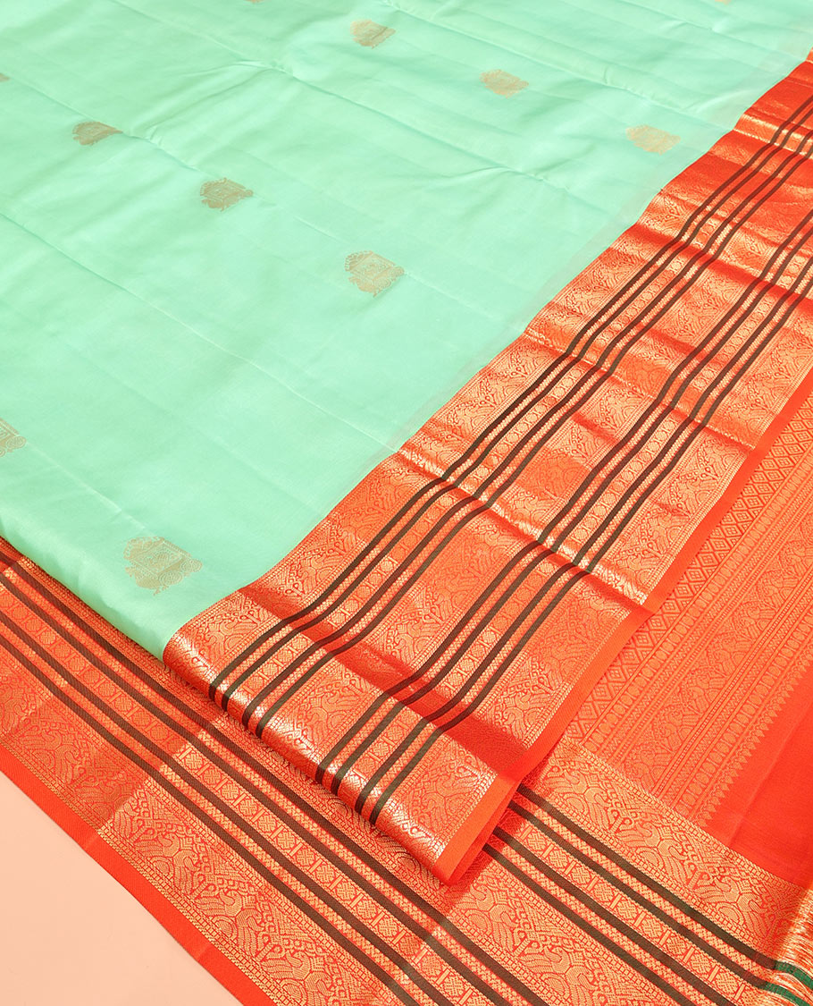 Turquoise Vasundhara Silk Saree, Finely Crafted with Zari Buttas, Complemented by a Contrast Border of Mayil, Neli, and Rudraksham Designs, Grand Pallu, and a Contrast Blouse
