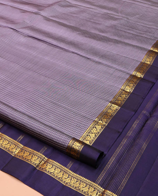 Grey Kanchipuram Silk Saree, Delicately Woven with Micro-Checked Designs on Its Body, Complemented by a Contrast Kal Eragina Border of Salngai, Banaras, Muthu, and Mayil Designs, Pallu Woven with Stripes, and Paired with a Contrast Blouse
