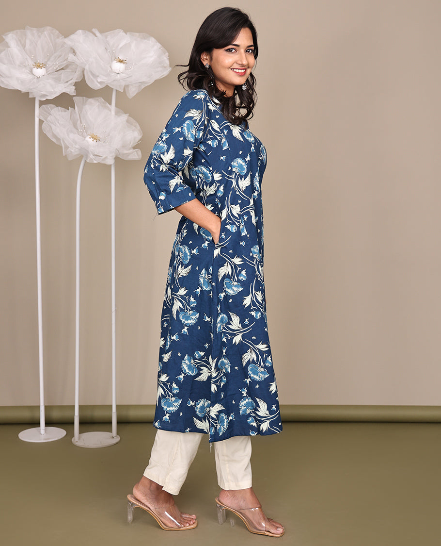 Blue Floral Printed Below-Knee-Length Cotton Kurti, Adorned with Round Neckline, 3/4 Sleeves, and A-Line Length