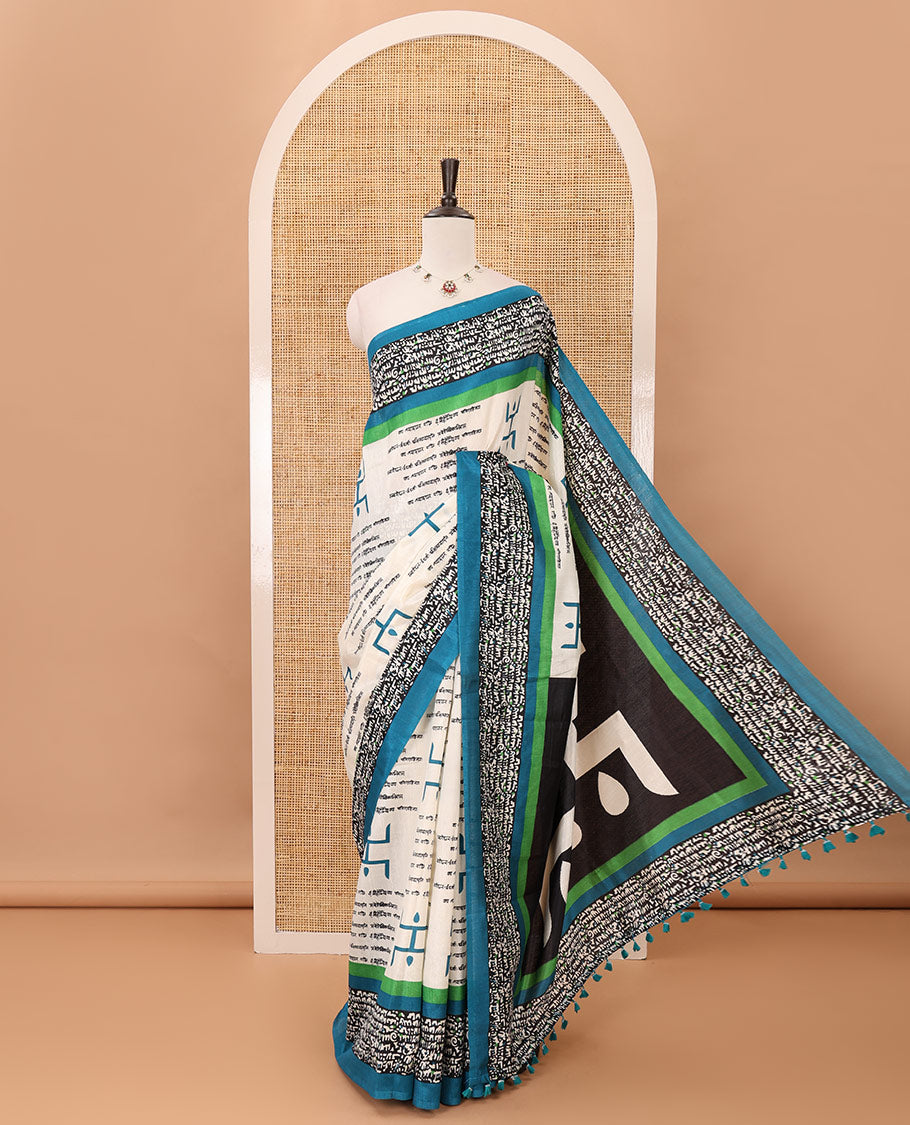 Chikku color swastika & Hindi typography printed jute cotton saree, contrast printed border, printed pallu & plain blue blouse