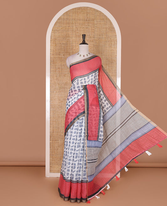 White cute elephant motifs printed linen cotton saree, contrast chevron border, pallu of stripes and chevron, and contrast printed blouse