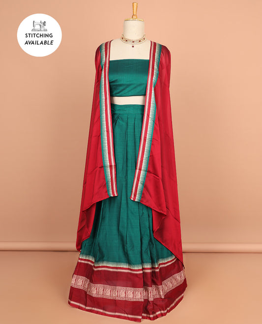 Green cotton half saree with contrast peacock motifs border, plain blouse & plain dhavani with striped design border