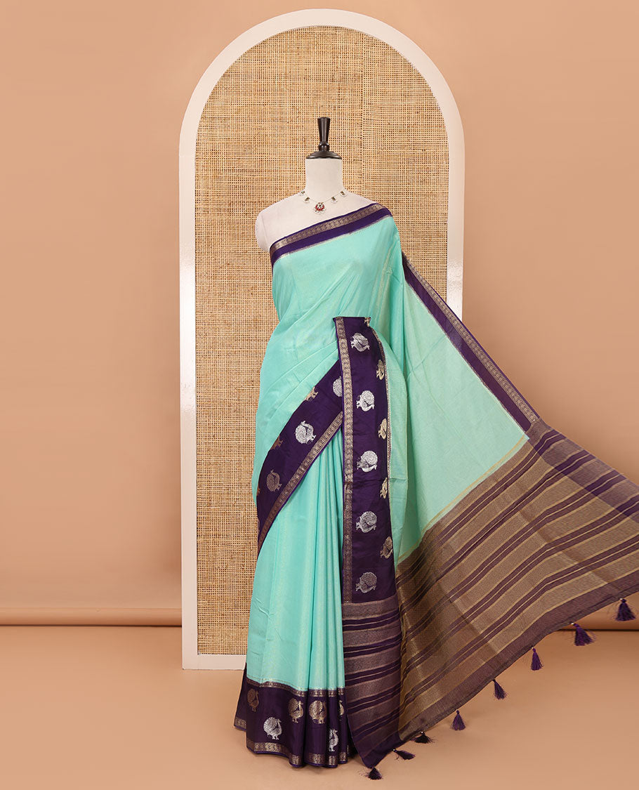 Blue plain Banarasi tissue silk saree, contrast traditional zari peacock border, zari striped pallu & floral jaal jacquard purple blouse