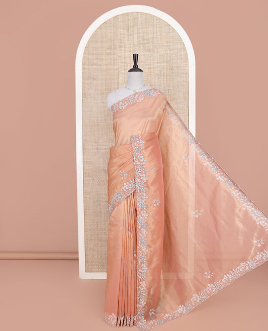 Peach Designer Saree, Beautifully Bedecked with Stone-Embroidered Buttas on Its Body, Highlighted by a Scallop Floral-Themed Embroidered Border, Self-Pallu, and Paired with a Matching Blouse