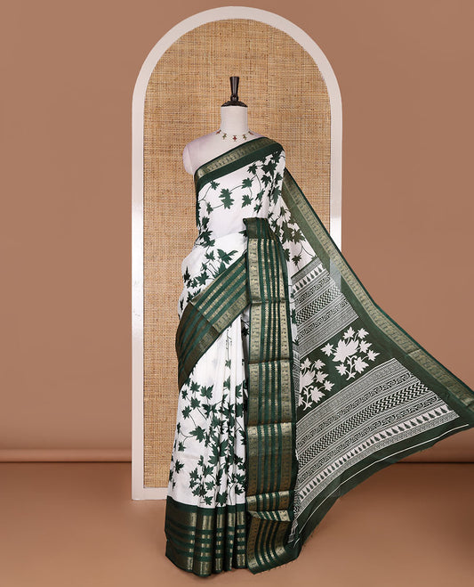 Green leaf motifs printed dola silk saree, contrast traditional zari border of Rudraksham and peacock motifs, geometric printed pallu and contrast printed blouse