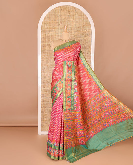 Pink chevron striped patola saree, contrast traditional zari and patola printed border, patola printed pallu, and a contrast blouse