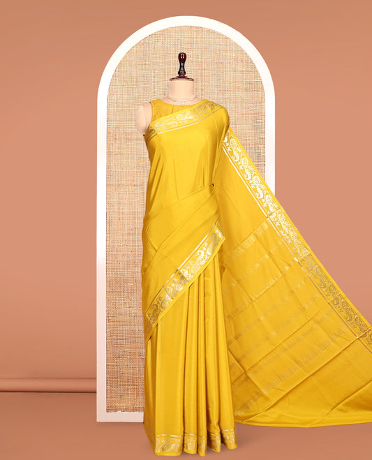 Yellow Plain Mysore Silk Saree, Highlighted by Zari Traditional Border of Peacock Designs, Pallu Steeped with Zari Stripes, and Paired with a Matching Blouse
