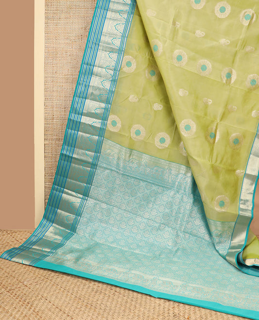 Light green floral buttas vasundhara elite silk saree with contrast intricate zari design border & floral zari design pallu