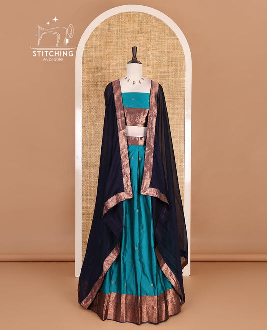 Rama blue taffeta silk half saree, zari buttas with contrast navy blue traditional zari border, matching zari blouse, and contrast plain zari border dhavani