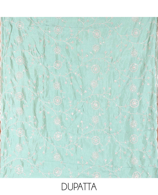 Cream with Green Vichitra Silk Material Chudidar Set, Elevated with Gold Zari Buttas On Its Top, a Plain Santoon Bottom, and Comes with a Floral Vine Sequins Embroidered Dupatta