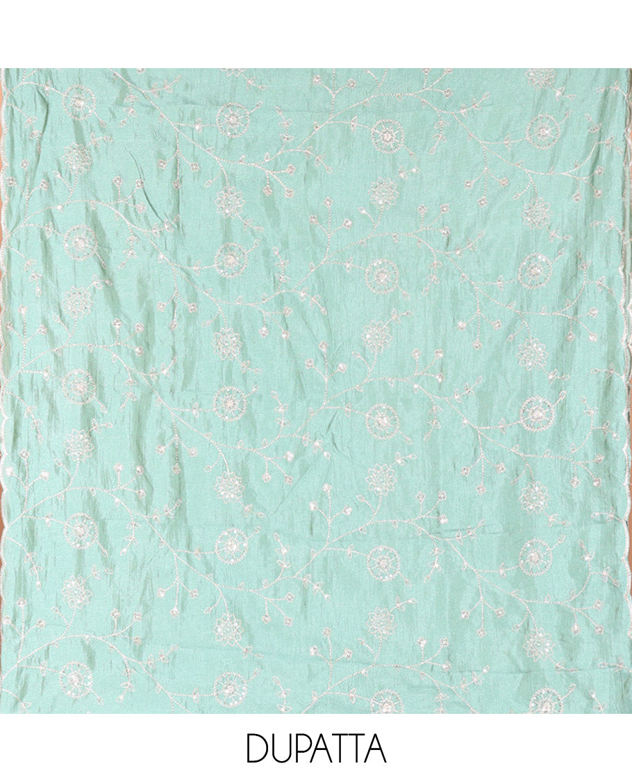 Cream with Green Vichitra Silk Material Chudidar Set, Elevated with Gold Zari Buttas On Its Top, a Plain Santoon Bottom, and Comes with a Floral Vine Sequins Embroidered Dupatta