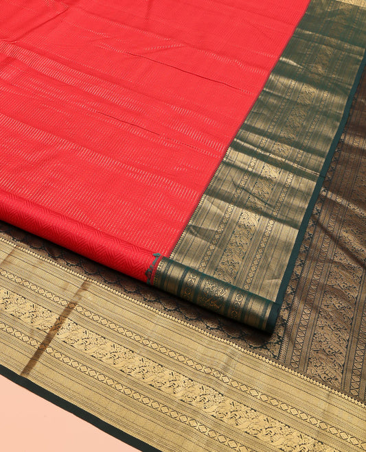 Red Kanchipuram Silk Saree, Woven with Geometric Patterns All Over Its Body, Complemented by Contrast Border of Thilakam Mokku, Kathir, Vanki, Banaras, Laddu Kamalam, and Mayil Designs, a Meticulously Crafted Pallu, and Paired with a Contrast Blouse