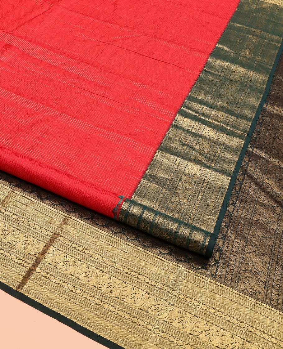 Red Kanchipuram Silk Saree, Woven with Geometric Patterns All Over Its Body, Complemented by Contrast Border of Thilakam Mokku, Kathir, Vanki, Banaras, Laddu Kamalam, and Mayil Designs, a Meticulously Crafted Pallu, and Paired with a Contrast Blouse