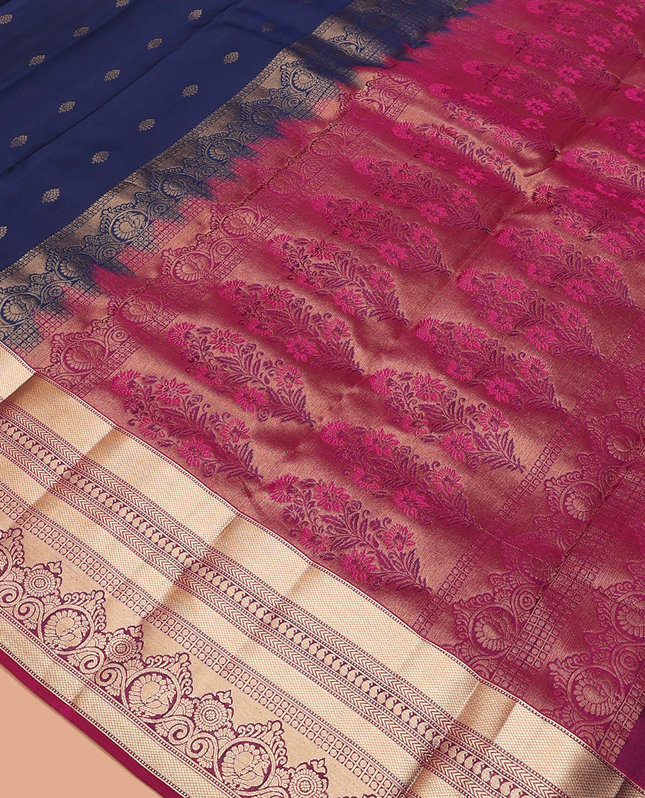 Navy blue zari buttas Vasundhara silk mix saree, contrast border of muthu, kuyil kann, kathir, manga, and mayil chakram designs, and floral design pallu