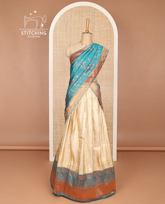Cream buttas banaras half saree with contrast traditional zari design border, zari design blouse & light blue floral vine design dhavani