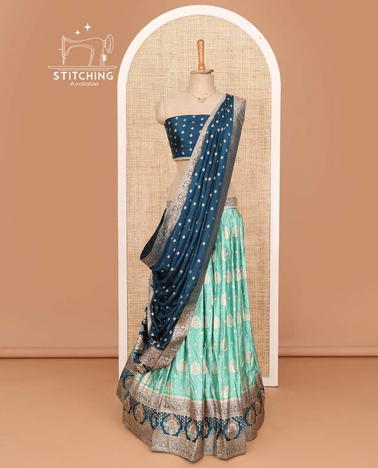 Green lehenga set, intricate motifs with contrast Mughal style bordered skirt, jacquard blouse, and banarasi zari design dhavani