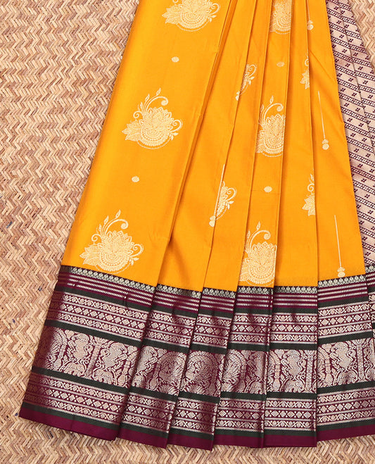 Yellow Budget Silk Saree, Sparsely Woven with Zari Buttas All Over Its Body, Complemented by a Contrast Traditional Zari Design Border, Pallu of Buttas and Stripes, and Paired with a Contrast Blouse