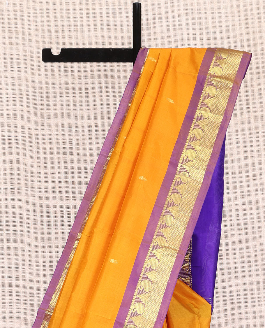 Yellow Kanchipuram Silk Saree, Subtly Sparkled with Zari Buttas, a Contrast Border of Thazampoo Rekku, Muthu, Manga, and Mayil Kann Designs, Zari Pallu, and a Contrast Blouse