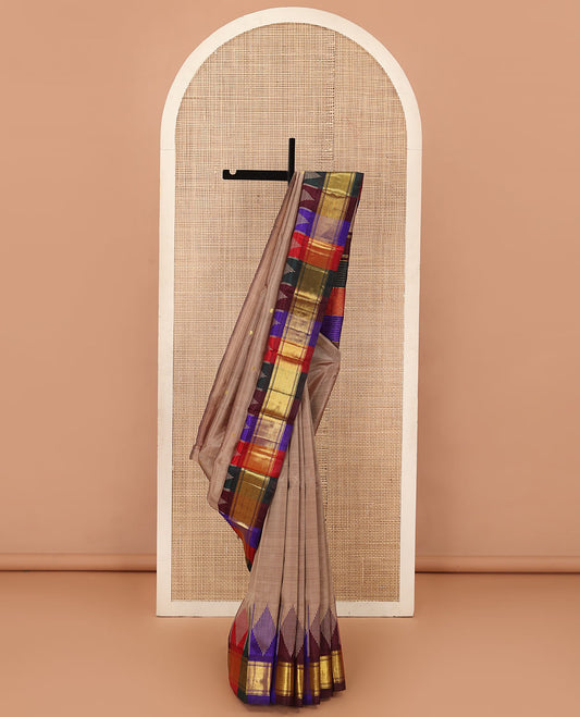 Brown zari buttas Kanchipuram silk saree, contrast multi-colored one-sided thazampoo rekku zari border, and multi-colored zari striped pallu