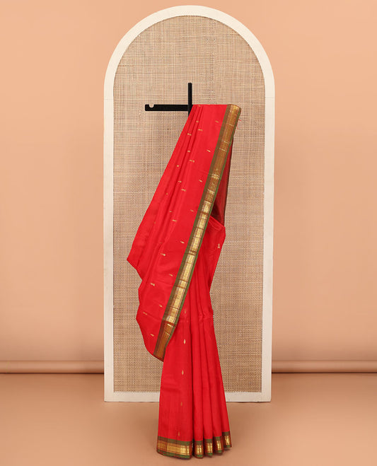 Red zari buttas Kanchipuram silk saree, contrast one-sided border of rekku, and mayil kann designs, zari design pallu