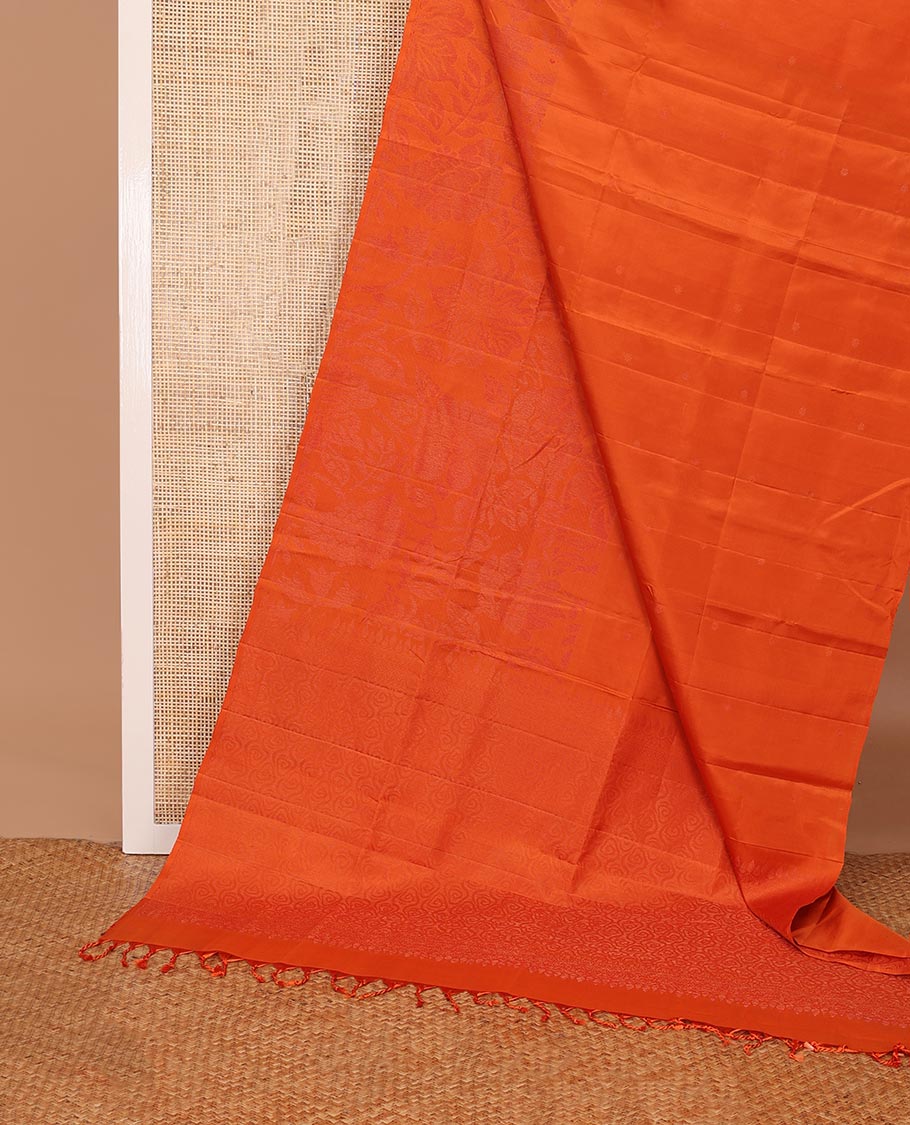 Borderless fanta orange sparsely woven floral design soft silk saree, geometric patterned pallu