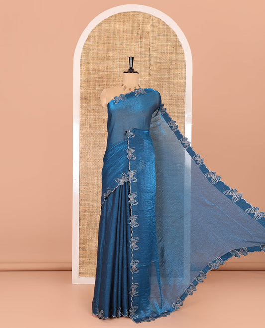 Blue plain fendy chiffon saree, scallop border of butterfly motifs in stone work, self-pallu, and a matching blouse