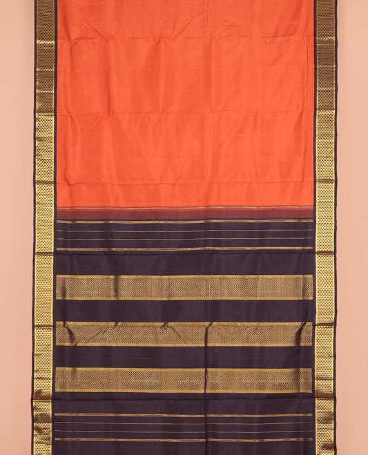 Orange plain nine-yard silk saree, contrast ara maadam design korvai border, and pallu of ara maadam designs